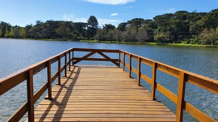 Fototapeta na wymiar Wooden pier with beautiful view of Lake São Bernardo - São Francisco de Paula, Rio Grande do Sul, Brazil.