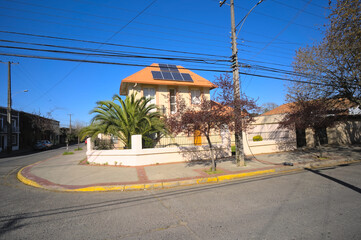 Corner house with solar panel in a small south American town, Talca, Chile