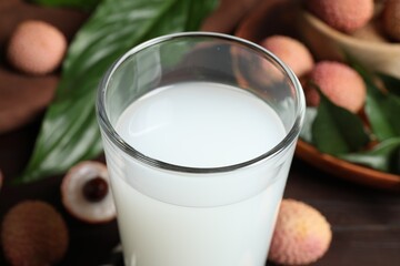 Freshly made lychee juice on wooden table, closeup