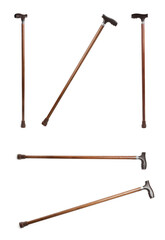 Set with elegant wooden walking canes on white background