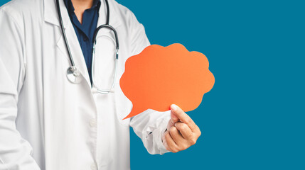 Doctor in uniform holding a red blank speech bubble while standing on a blue background