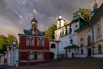 Fototapeta na wymiar View of the Assumption Cathedral, the Great Belfry and the sacristy in the Holy Dormition Pskov-Pechersk Monastery, Pechory, Pskov region, Russia. Inscription: 