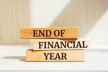Wooden blocks with words 'End Of Financial Year'. Business concept