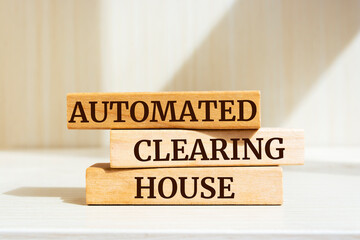 Wooden blocks with words 'Automated Clearing House'.