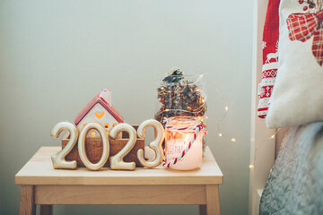 Numbers 2023 on with festive Christmas decor. Happy New Year 2023. Copy space
