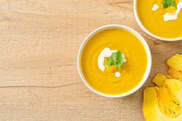 pumpkin soup in white bowl