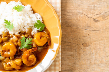 Shrimps in curry sauce on rice