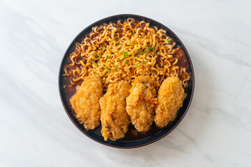 Korean instant noodles with fried chicken or Fried chicken ramyeon