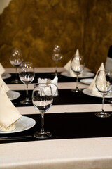 Banquet table with wineglasses. High angle of elegant banquet table served for wedding celebration