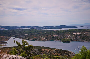 Fototapeta na wymiar High angle view of a deep bay in Adriatic sea with islands in background