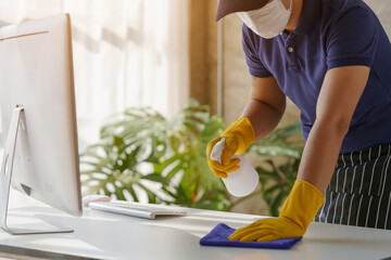 Close up man with cloth cleaning working desk table.