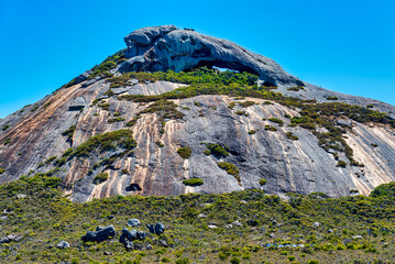 Frenchman Peak is a distinctively shaped rocky peak with a cave and a steep trail to the summit.