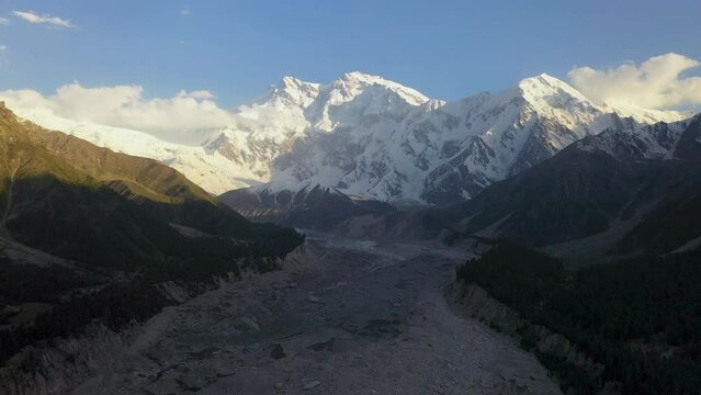 Wide drone shot of Nanga Parbat with a glacier in valley, Fairy Meadows Pakistan, cinematic wide revealing aerial shot