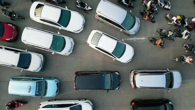 Chaotic motorcycle and cars moving on the road