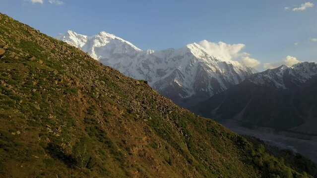 Aerial shot of Nanga Parbat, Fairy Meadows Pakistan, cinematic rotating and revealing drone shot