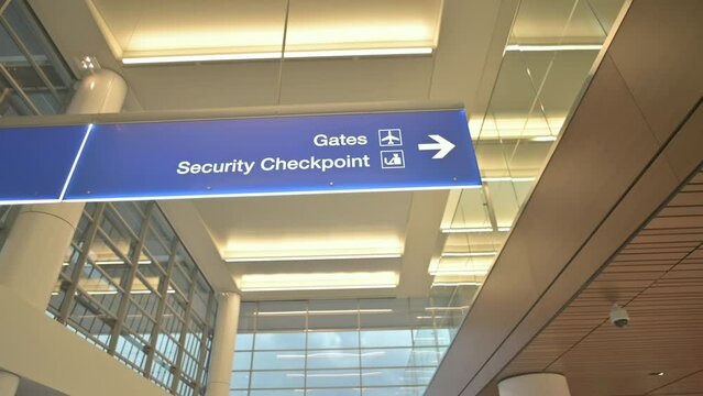 Gates and Security checkpoint sign at airport