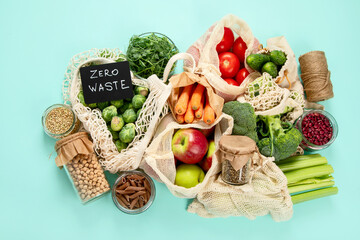 Various organic fruits and vegetables in reusable packaging bags.