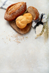Bread assortment on neutral background.
