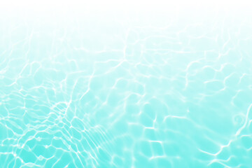 Bluewater waves on the surface ripples blurred. Defocus blurred transparent blue colored clear calm water surface texture with splash and bubbles. Water waves with shining pattern texture background.