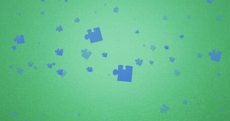 Illustration of blue jigsaw pieces in mid-air over green background