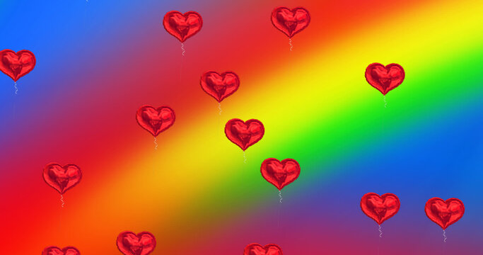 Image of hearts balloons on rainbow background