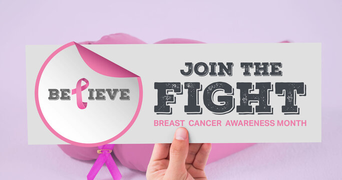 Image of pink ribbon logo with breast cancer text over boxing gloves