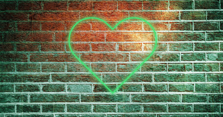 Image of glowing neon heart icon on brick wall