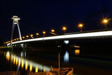 Fototapeta na wymiar Bratislava, Slovakia - Aug 28, 2022:New bridge (Most SNP) in Bratislava at night. Bridge of the Slovak National Uprising or the UFO Bridge is a road bridge over the Danube in Bratislava.