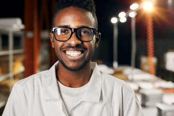 African engineer working with tablet at factory