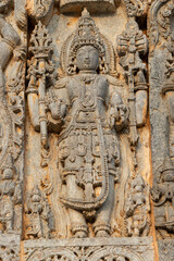 Fototapeta na wymiar The Sculpture of Hindu God and Goddess on the Hoysaleshwara Temple, Halebeedu, Hassan, Karnataka, India.