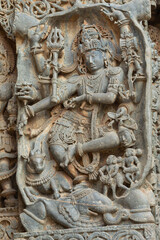 Fototapeta na wymiar The Dancing Sculpture of Lord Shiva on the Hoysaleshwara Temple, Halebeedu, Hassan, Karnataka, India.
