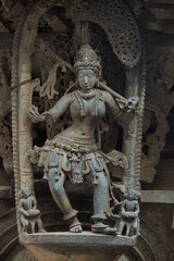 Fototapeta na wymiar Broken Sculpture of Dancer on the Hoyasaleshwara Temple, Halebeedu, Hassan, Karnataka, India.