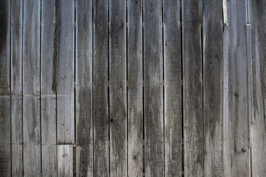 background wall facade of raw wood plank facade aged by time