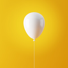White flying air helium balloon against yellow background.