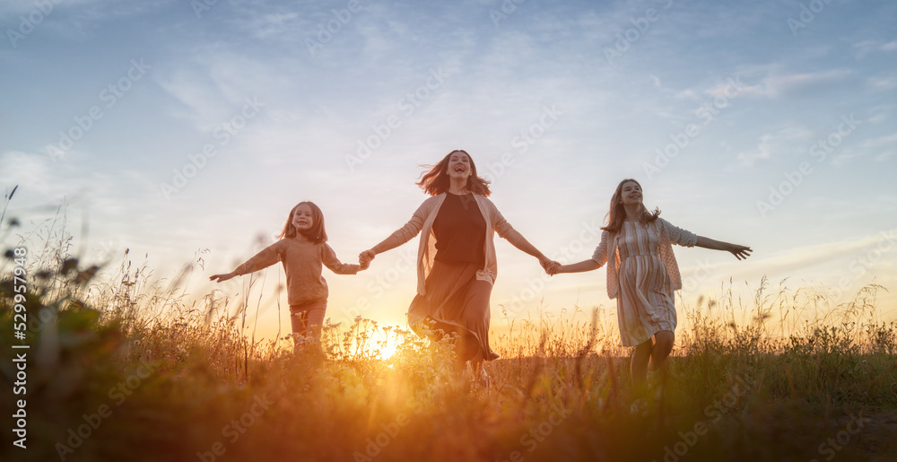 Poster happy family at sunset