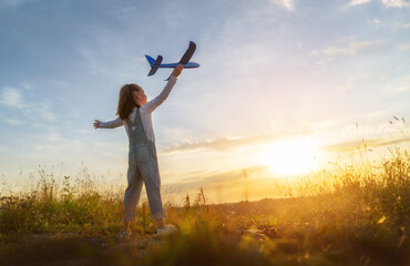 Fototapeta na wymiar Happy kid with toy plane