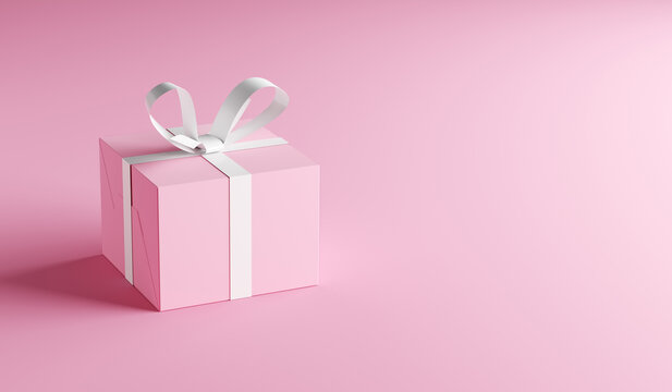 Pink gift box with white ribbon on pink background with copy space.