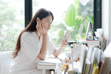 woman freelancer sitting on chair in home