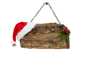 Christmas template - old wooden sign with Santa hat and spruce twig hanging on a rusty chain isolated on a transparent background.