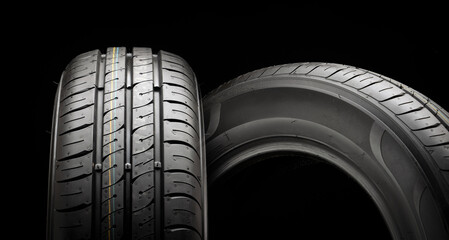 Two new summer wheels on a black tire background graphically