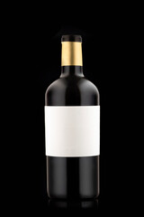 a small full bottle of beer or wine on a black background, with a blank white label