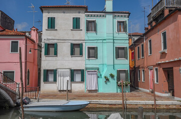 Fototapeta na wymiar Colorful houses on the canal in Murano island, Venice, 