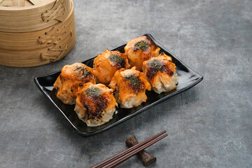 Dimsum with Japanese Mentai Sauce. Served on plate.
