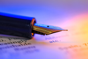 Close up view of fountain pen on a historic book