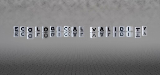 ecological validity word or concept represented by black and white letter cubes on a grey horizon background stretching to infinity