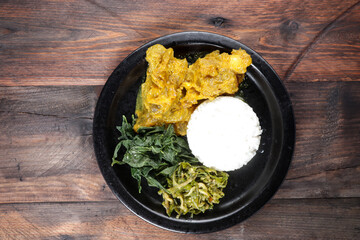 Nasi Padang with Gulai Kikil and various side dish.