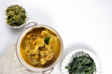 Gulai Tunjang or Kikil or Gulai Kaki Sapi is a popular spicy cow's trotter curry in Padang (West Sumatra-Indonesia) cuisine. Food preparation for the feast of Eid al-Fitr and Eid al-Adha