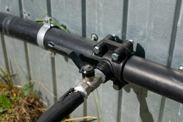 Connection of plastic sewer pipes closeup. Irrigation system for vegetable garden concept