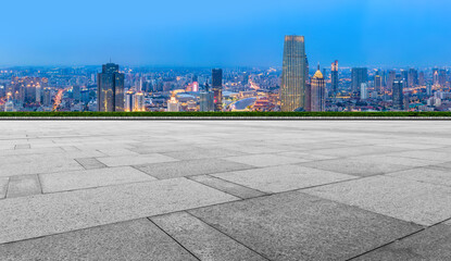 Empty floor tiles and city buildings background