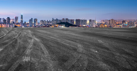 Empty road and city buildings background